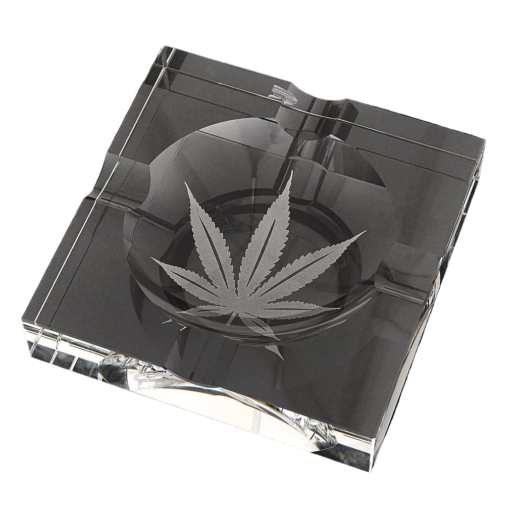 Clear glass cigar ashtray with marijuana leaf design etched in center
