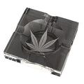Clear glass cigar ashtray with marijuana leaf design etched in center