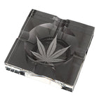 Clear glass cigar ashtray with marijuana leaf design etched in center