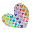 A freestanding, heart-shaped acrylic block with a multicolored pattern of hearts on it.