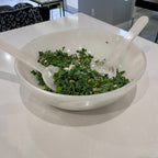 large white resin salad bowl with swirl design and servers included