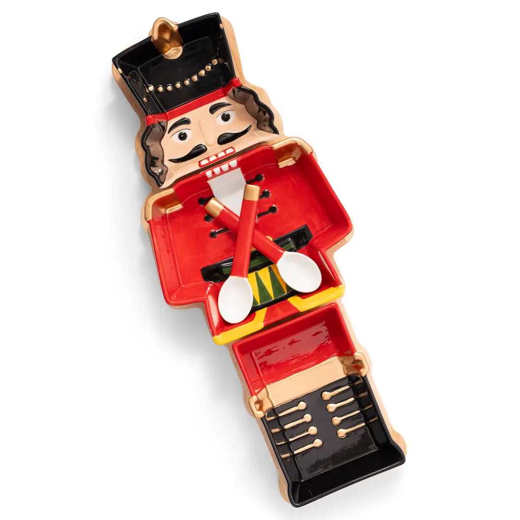 Wooden nutcracker charcuterie board with ceramic serving dishes for Christmas