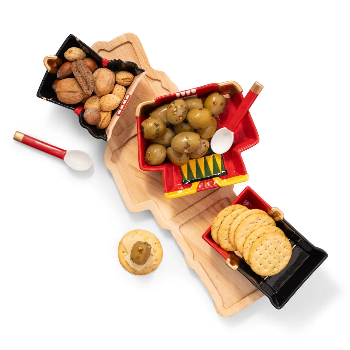 Wooden nutcracker charcuterie board with ceramic serving dishes for Christmas