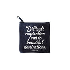 square mini pouches with zipper closures, each featuring a different text quote design in colors black, white, and multicolor. quote says difficult roads often lead to beautiful destinations