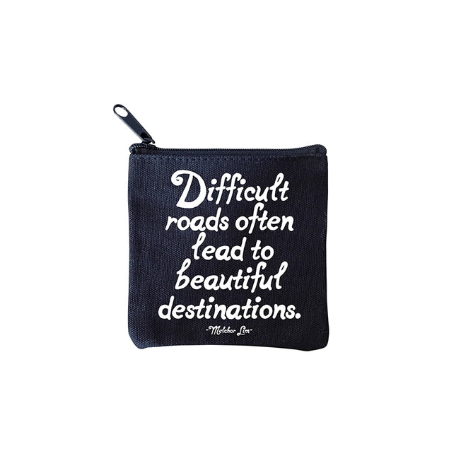 square mini pouches with zipper closures, each featuring a different text quote design in colors black, white, and multicolor. quote says difficult roads often lead to beautiful destinations