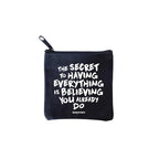 square mini pouches with zipper closures, each featuring a different text quote design in colors black, white, and multicolor. quote says the secret to having everything is believing you do
