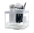 A clear plastic swivel silverware caddy with marble design accents, containing cutlery and a napkin holder.